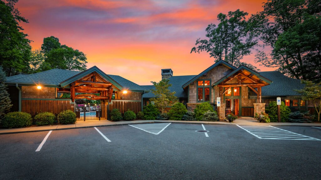 Resort clubhouse exterior photographed at twilight