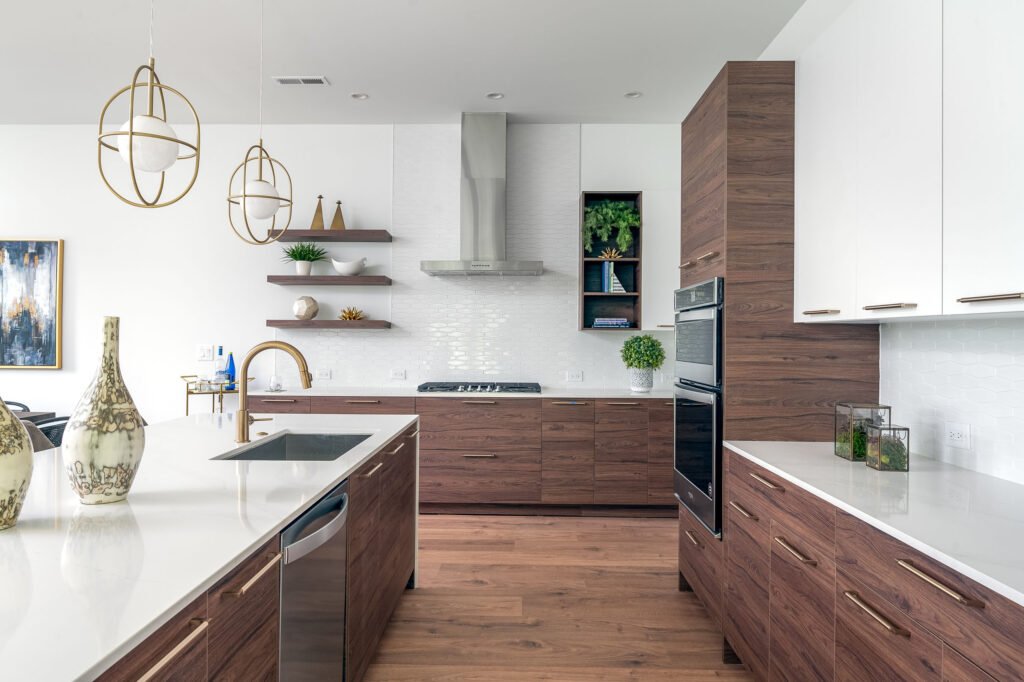 Kitchen with walnut cabinets and brass pendant lighting