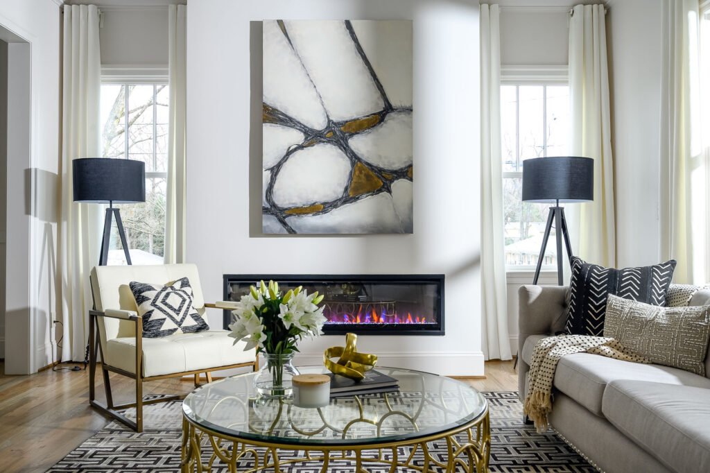 Living room with a linear fireplace and staged furnishings