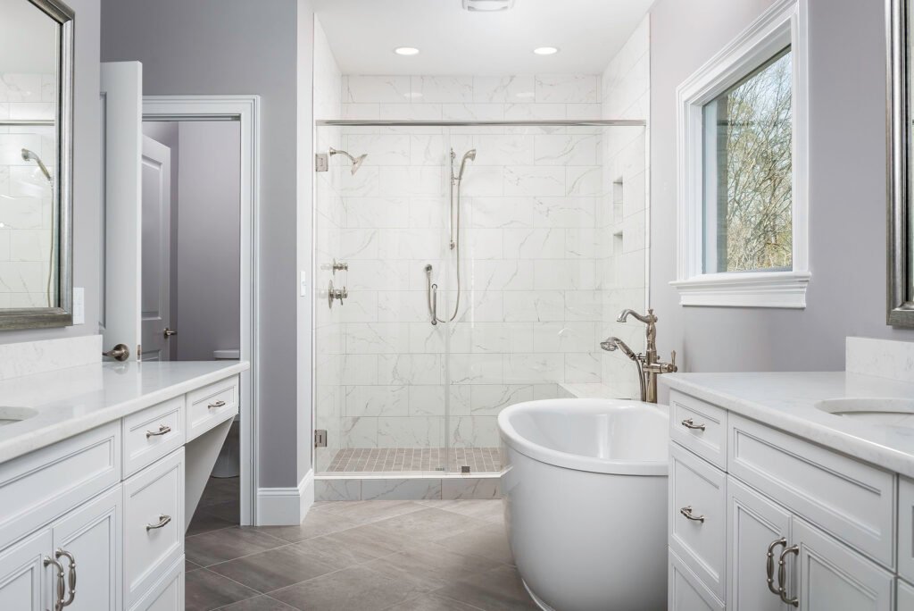 Primary bathroom with a freestanding tub and marble shower