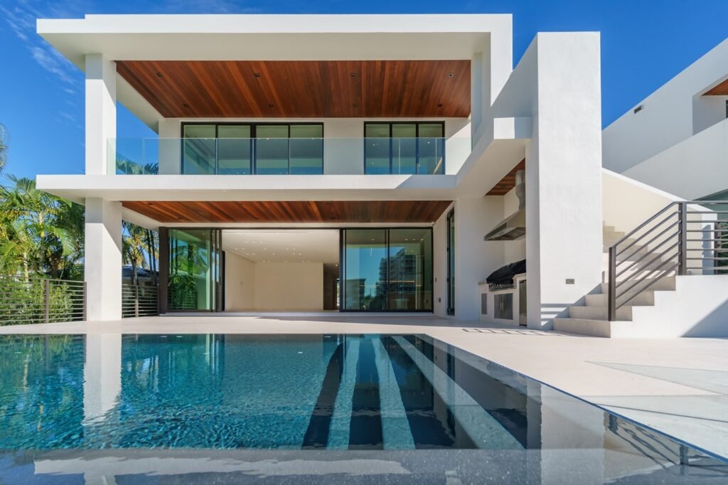 Twilight exterior of a Las Vegas home with a lit pool